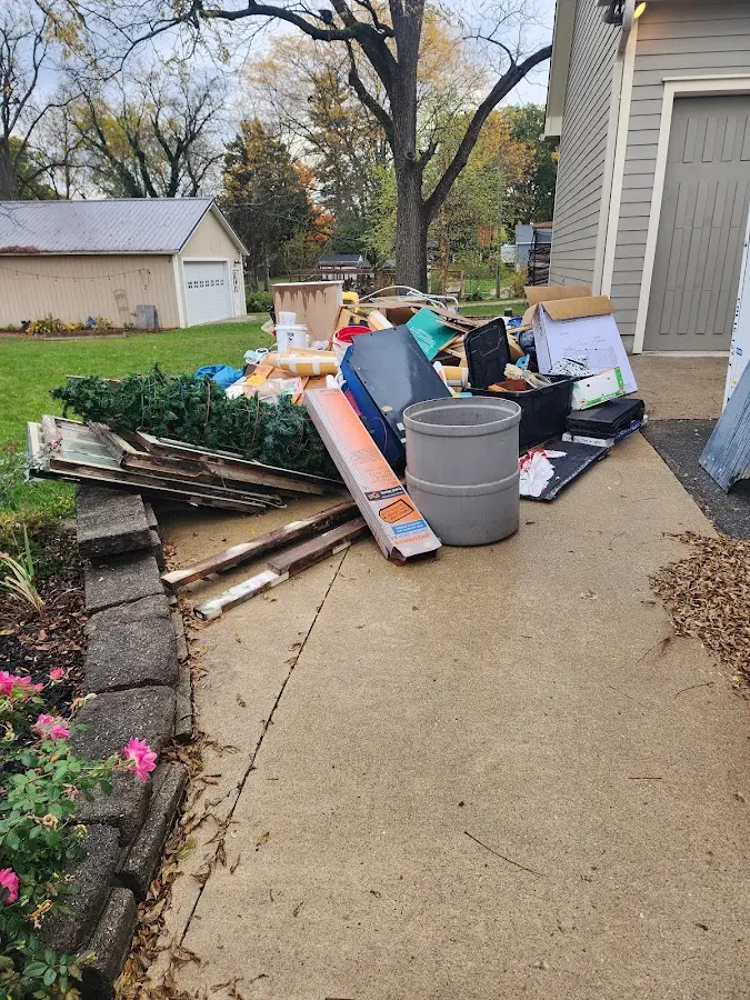 Dumpster being loaded with debris for Commercial Dumpster Rental in Crozet